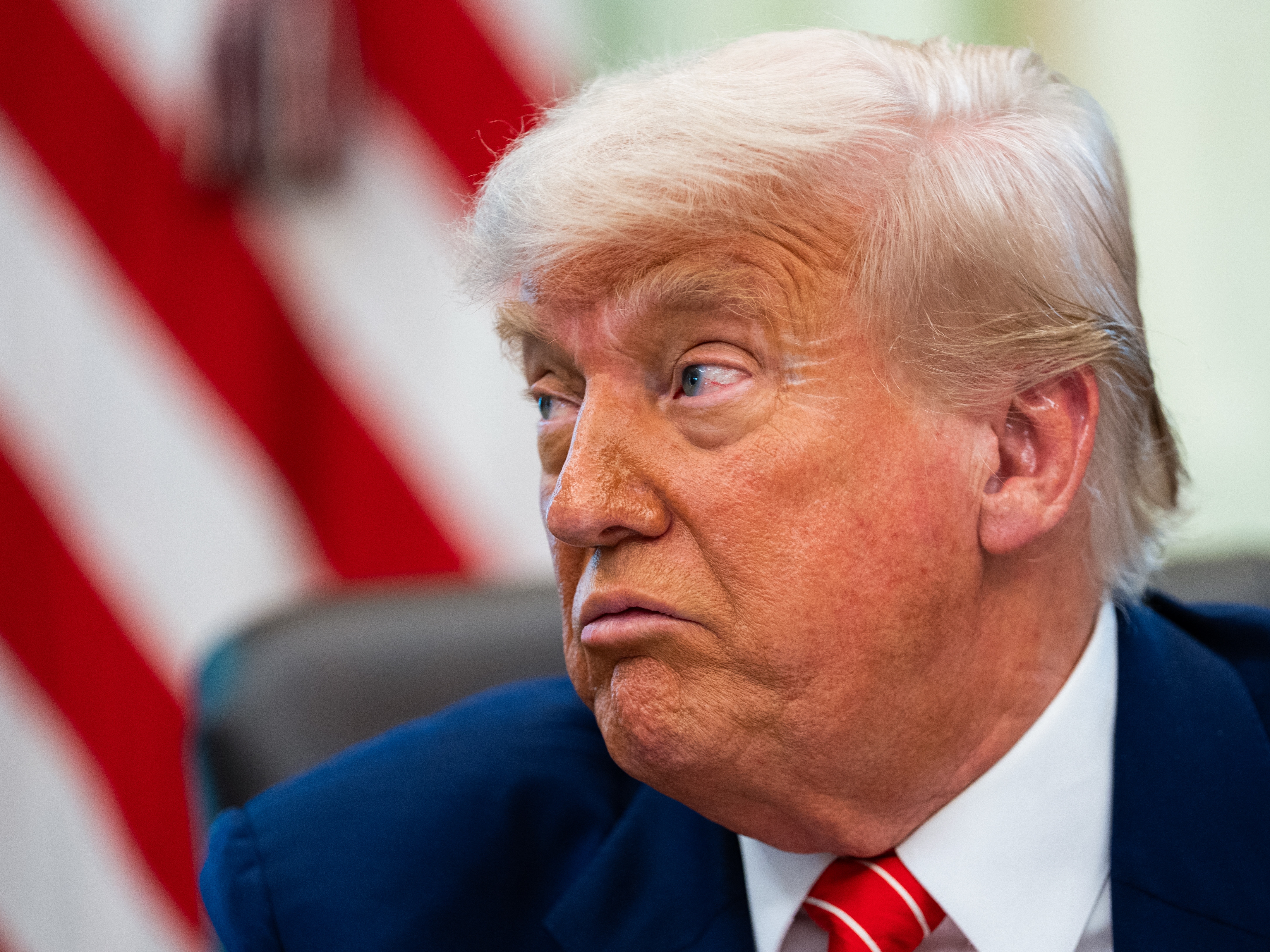 caption: President Trump speaks during a news conference in the Oval Office of the White House in Washington.