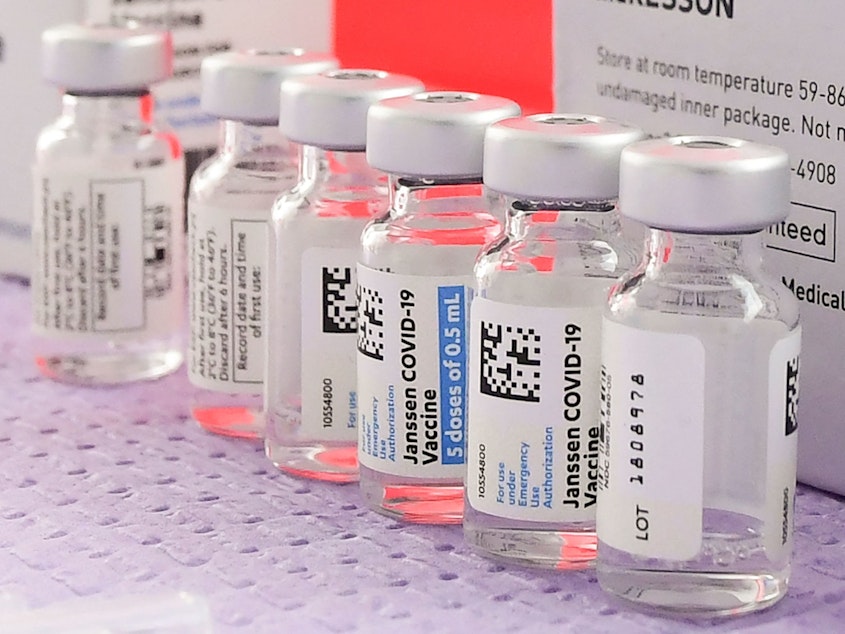 caption: Bottles of the single-dose Johnson & Johnson COVID-19 vaccine await transfer into syringes for administering last month in Los Angeles before its pause.