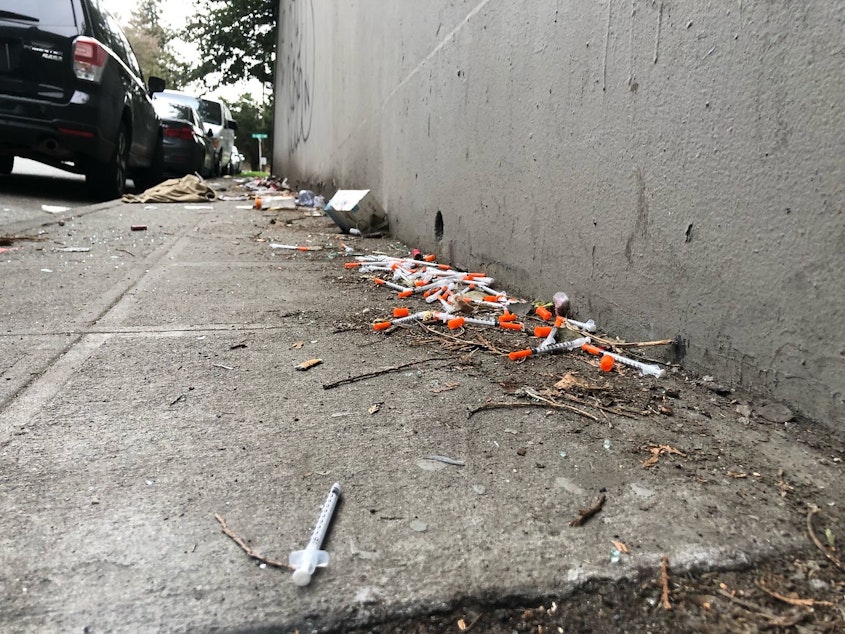caption: Needles on the ground in the University District that were reported to Seattle's Find It, Fix it app, March 25, 2019. 