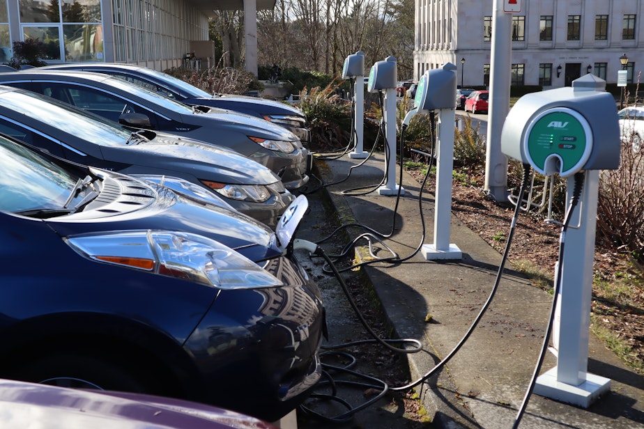 caption: Electric cars parked at the Washington State Capitol Thursday.