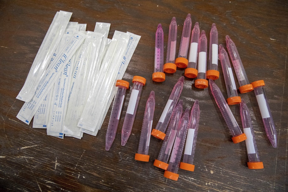 caption: Test swabs and specimen tubes sit on a table at a COVID-19 testing site at the Abyssinian Baptist Church  in the Harlem neighborhood of New York. (Mary Altaffer/AP)