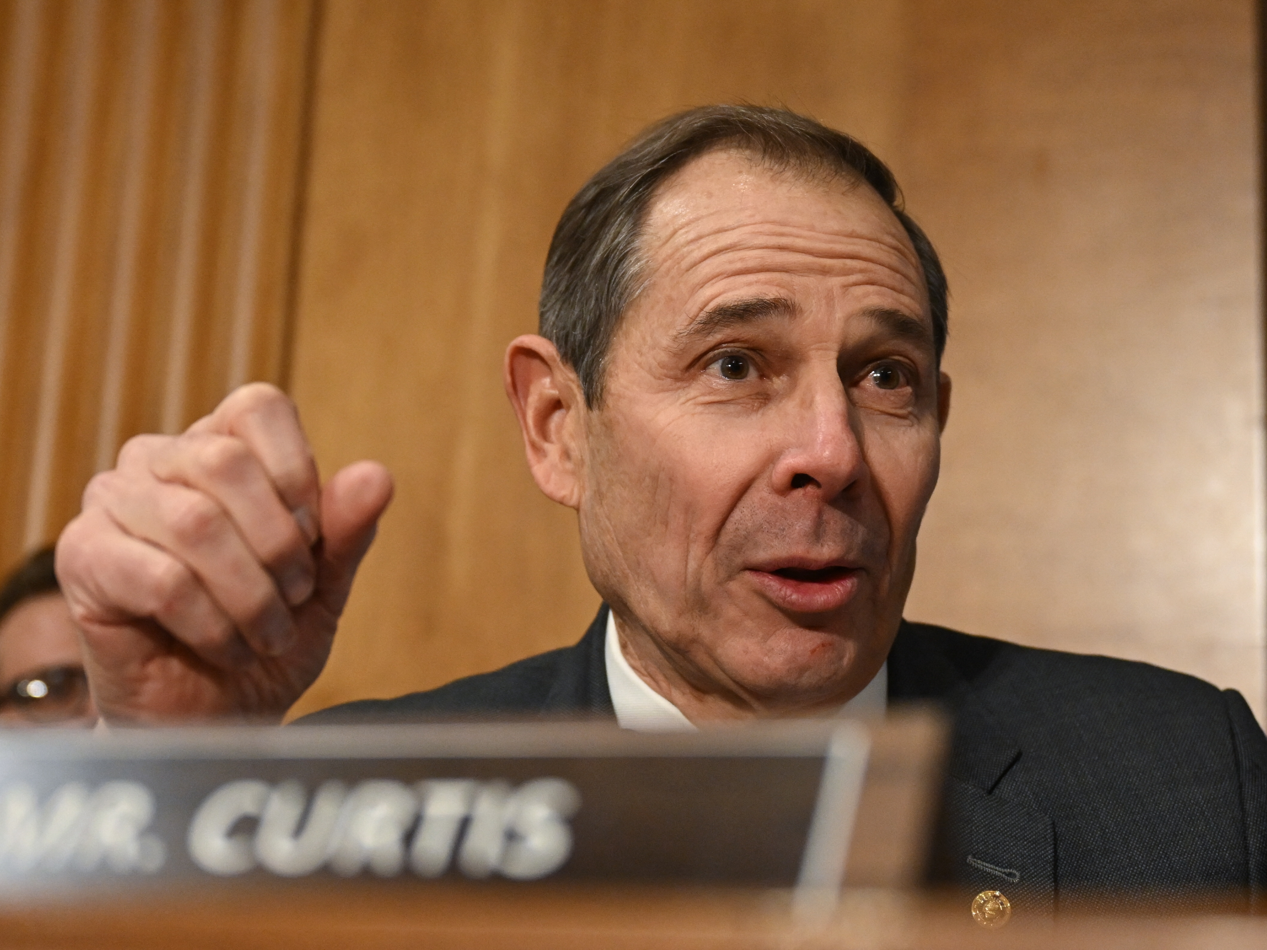 caption: Republican Sen. John Curtis of Utah, seen here on Capitol Hill in January,  wants to see a careful evaluation of the merit of each tax credit and thoughtful phase-outs.