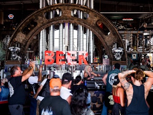 caption: The Full Throttle Saloon in Sturgis, S.D., draws a crowd earlier this month during the 80th annual Sturgis Motorcycle Rally.