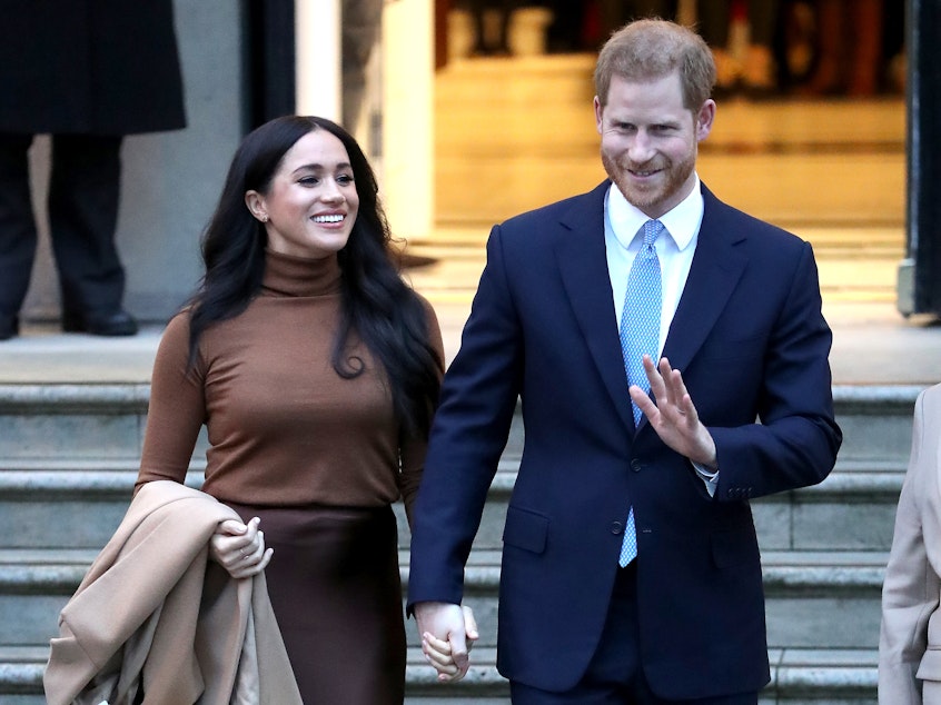 caption: The duke and duchess of Sussex, also known as Prince Harry and Meghan Markle, have announced that they will step back from certain royal duties. The couple is seen here on Tuesday in London.