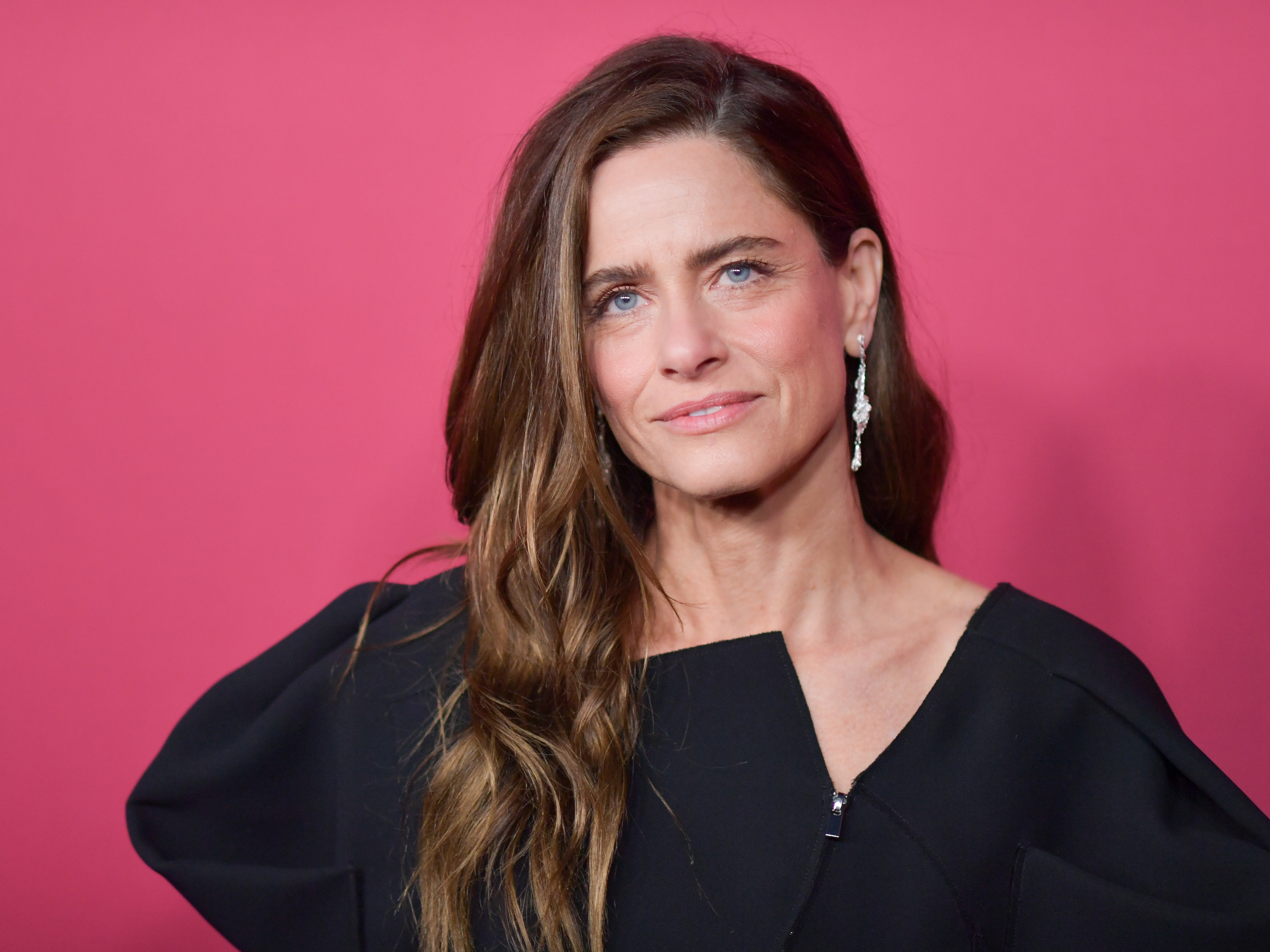 caption: Amanda Peet stars in <em>Your Friends &amp; Neighbors </em>on Apple TV which is now in its second season. She's pictured above in Los Angeles on Oct. 16, 2025.
