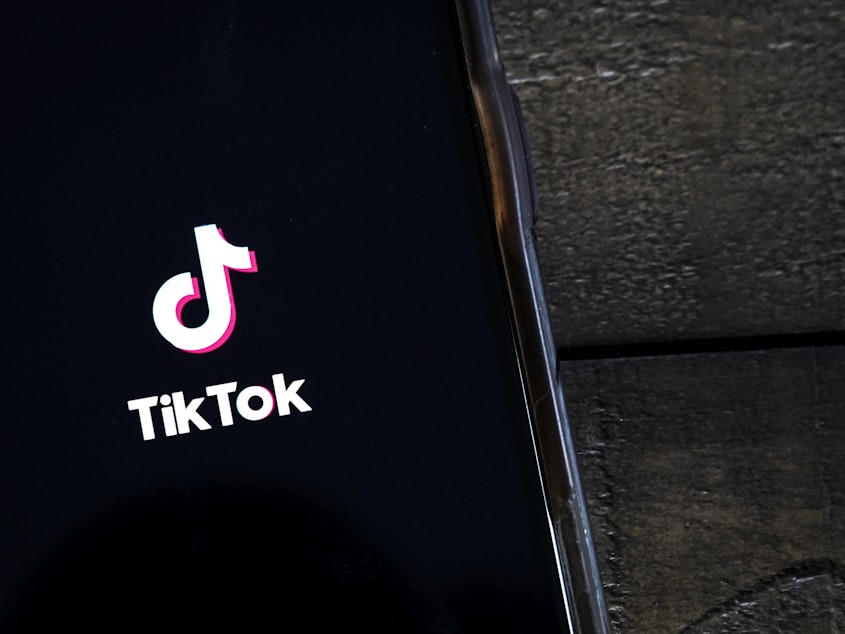 caption: TikTok is facing allegations of discrimination and retaliation by two of its former employees.
