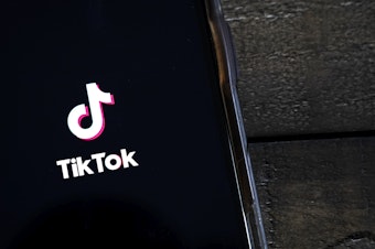 caption: TikTok is facing allegations of discrimination and retaliation by two of its former employees.