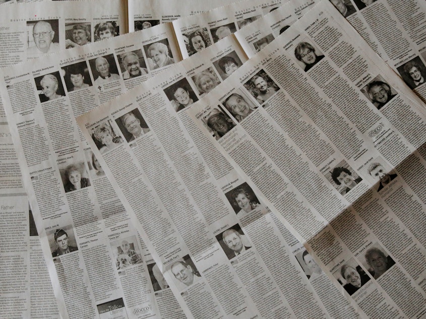 caption: The April 19 edition of <em>The Boston Globe</em> had 16 pages of obituaries.