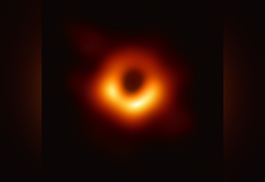 caption: First image of a black hole by the Event Horizon Telescope.