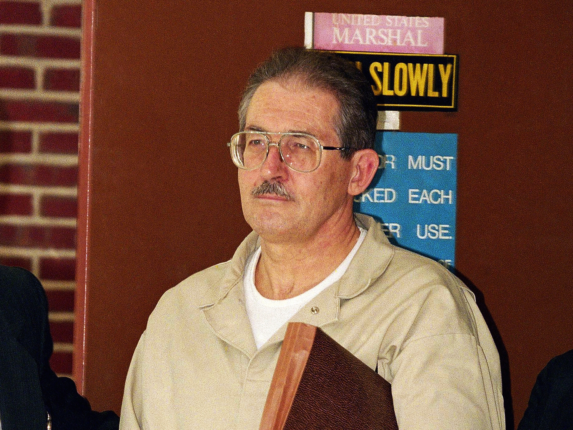caption: Former CIA agent Aldrich Ames leaves federal court after pleading guilty to espionage and tax evasion conspiracy charges April 28, 1994, in Alexandria, Va.