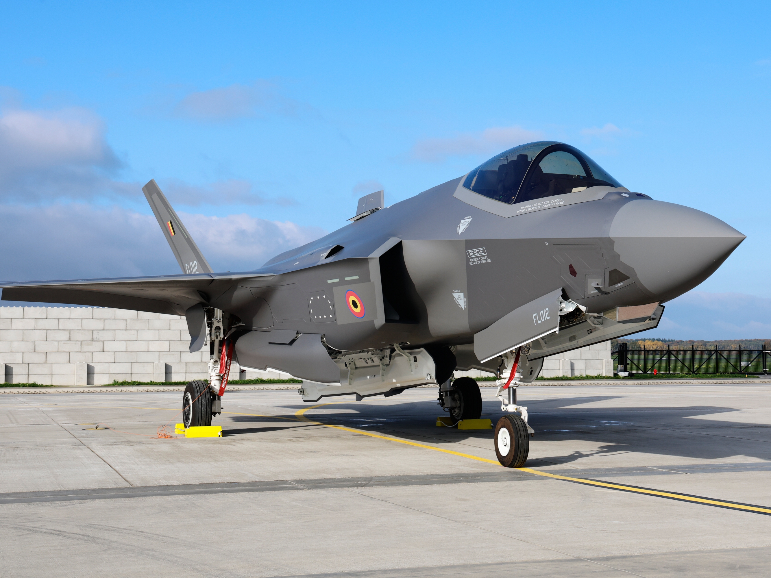 caption: An F-35A Lightning II sits on the runway at the Florennes Airbase in Florennes, Belgium, Oct. 13, 2025.