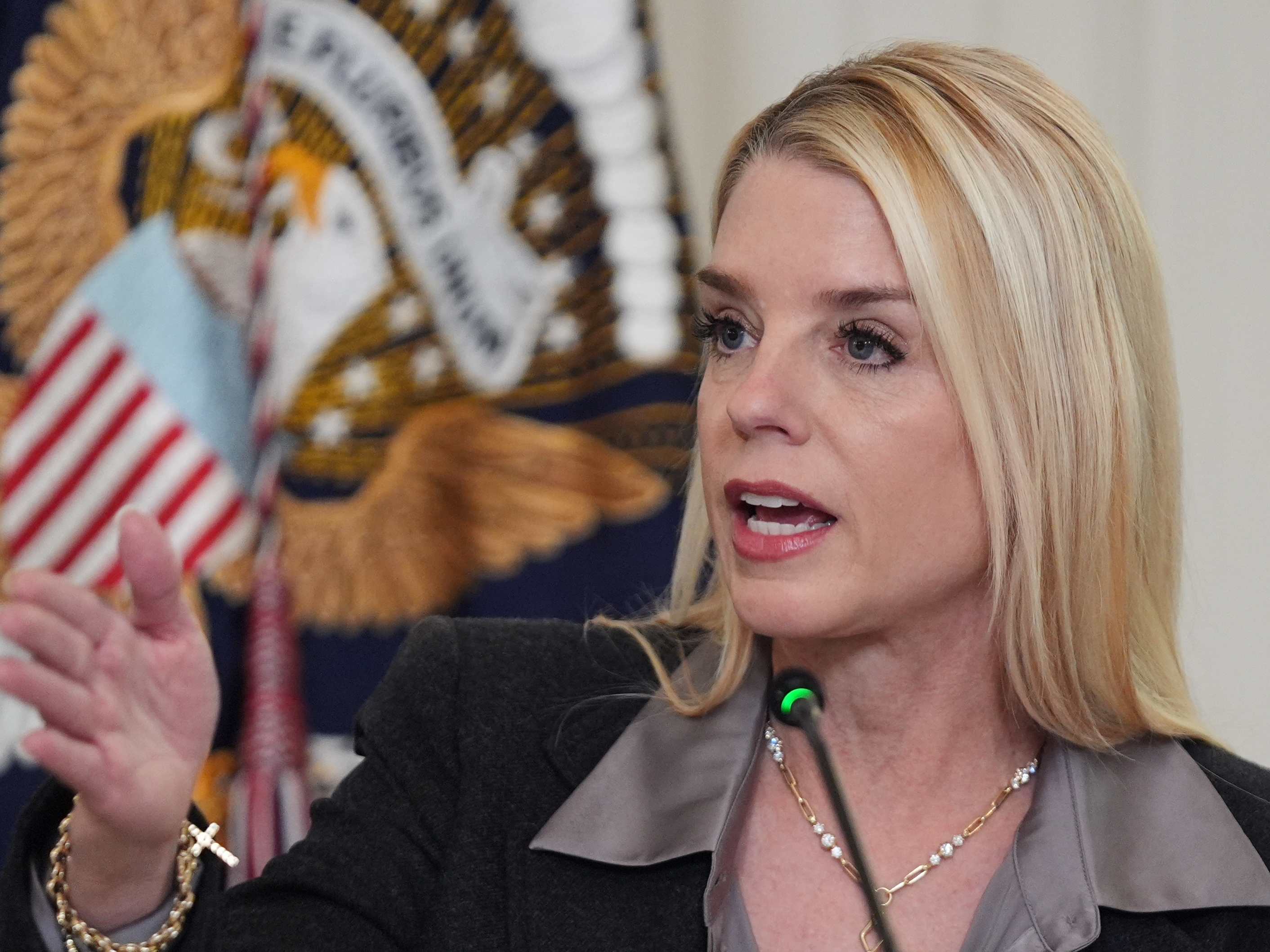 caption: Attorney General Pam Bondi speaks during a roundtable on criminal cartels with President Donald Trump in the State Dining Room of the White House, Thursday, Oct. 23, 2025, in Washington.