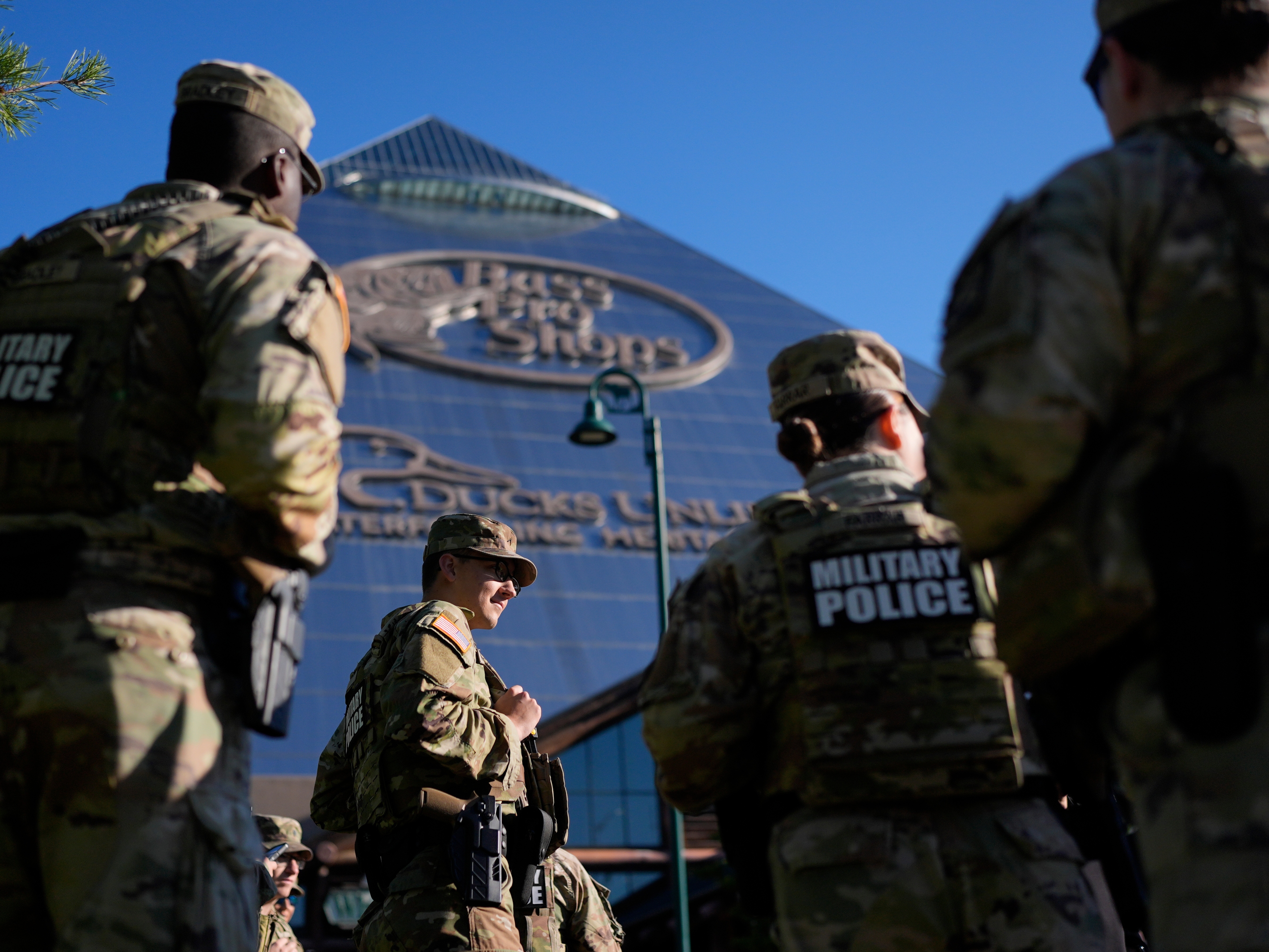 caption: Members of National Guard patrol outside a Bass Pro Shops on Oct. 10 in Memphis, Tenn.