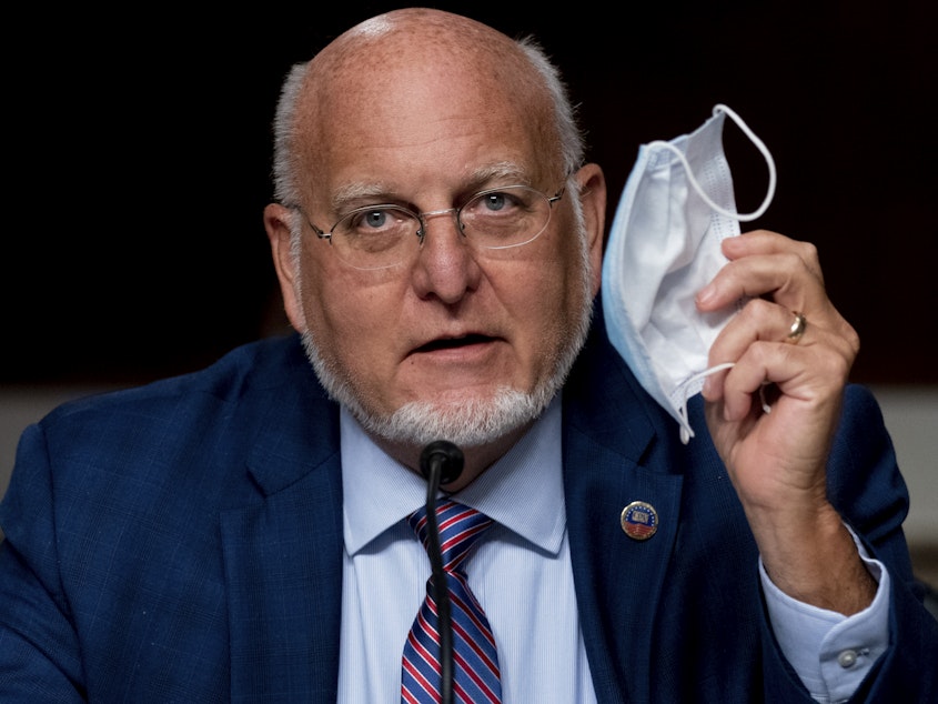 caption: CDC Director Robert Redfield says wearing a mask may provide better protection against COVID-19 than a vaccine.