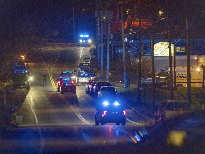 caption: Police respond to an active shooter situation in Lewiston, Maine, late on Wednesday.