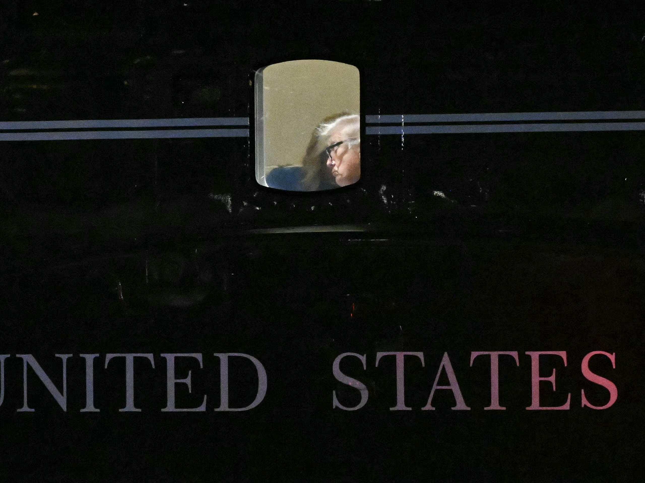 caption: President Trump is seen aboard Marine One before departing from New York City on September 12, 2025, for his Bedminster golf resort in New Jersey.