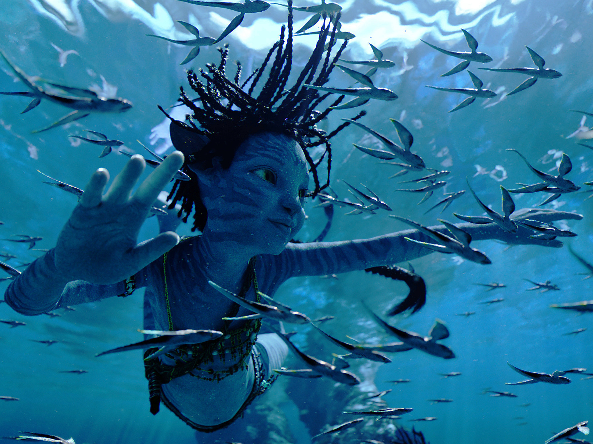 caption: This image released by 20th Century Studios shows Trinity Bliss, as Tuk, in a scene from <em>Avatar: The Way of Water</em>.