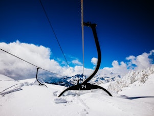 caption: A nearly buried chair on a lift at Mammoth Mountain in mid-March. The resort had its snowiest winter on record, having recorded over 700 inches at the base area and nearly 900 inches at the mountain's summit.