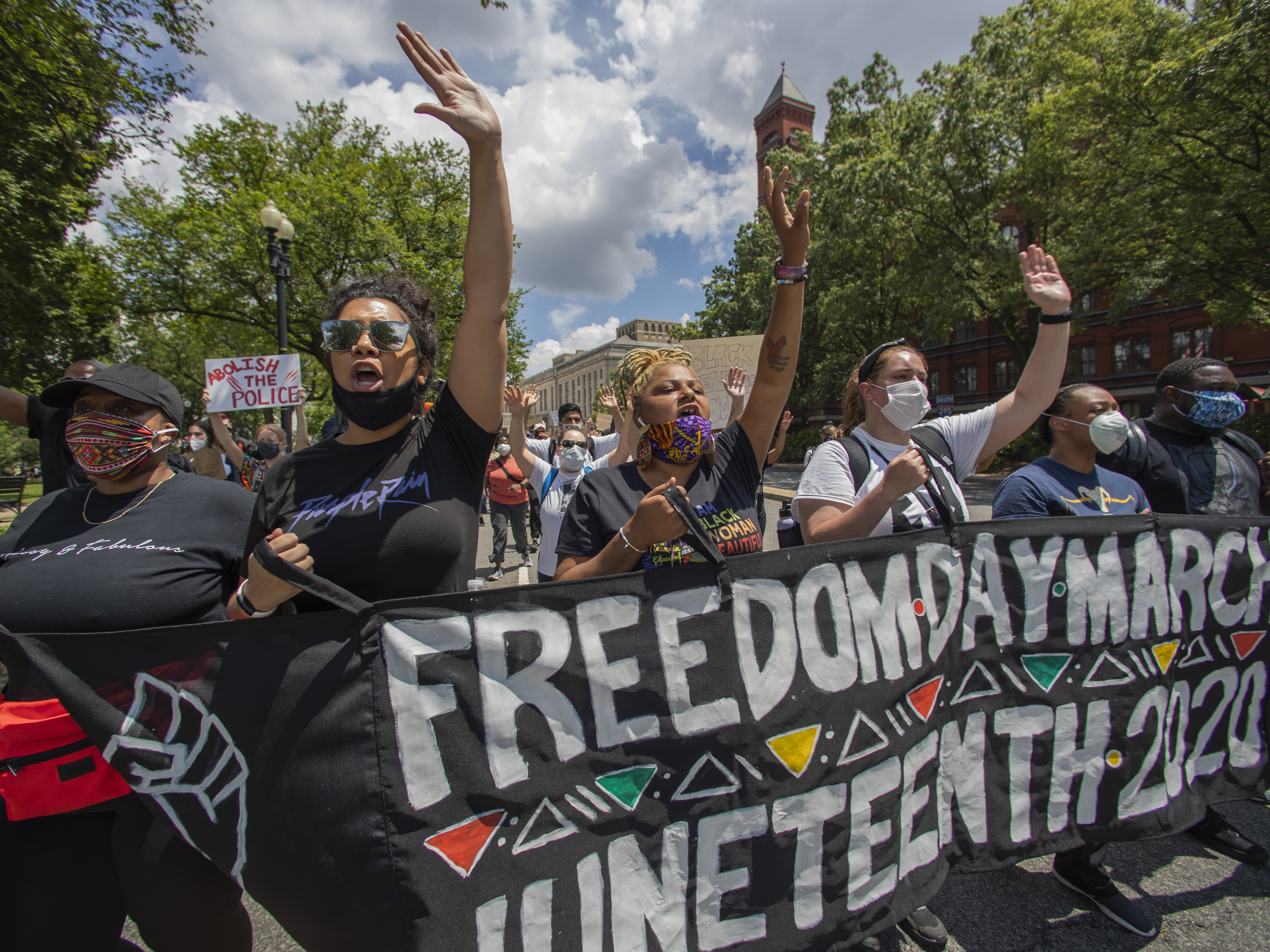 caption: People observe a moment of silence at the Martin Luther King Jr. Memorial in Washington on Friday, June 19, 2020, to mark Juneteenth. (AP Photo/Manuel Balce Ceneta)