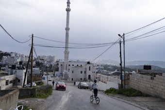 caption: A view of the mosque known as the "Hamas mosque" in Silwad. The town is the birthplace of Khaled Mashal, a founding member of the militant group behind the Oct. 7 attack on Israel. Those who don't support Hamas — a sizable majority in the West Bank — attend other mosques in Silwad.