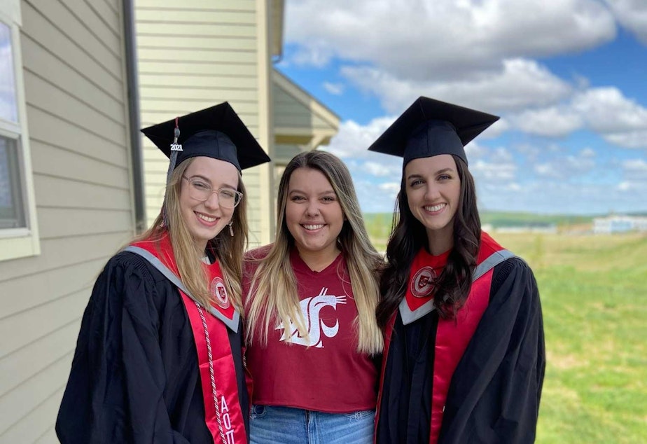 caption: [Left] Annaka celebrated her virtual graduation with her college roommates, [middle] Mackenzie Nation, and [right] Anna Kleinbach. Annaka wore her strawberry fuzzy socks, and Kleinbach wore her pink fluffy slippers. 