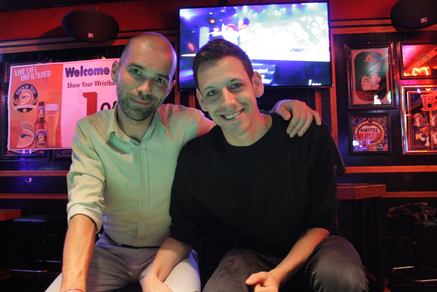 caption: Tyler Reedus (right) and Joshua Thomas at the Madison Pub in District 3