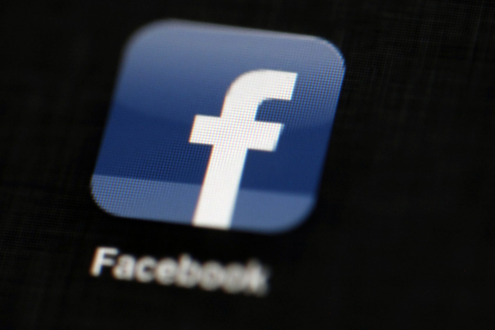 caption: The Facebook logo in 2012 is displayed on an iPad in Philadelphia. (Matt Rourke, AP file photo)