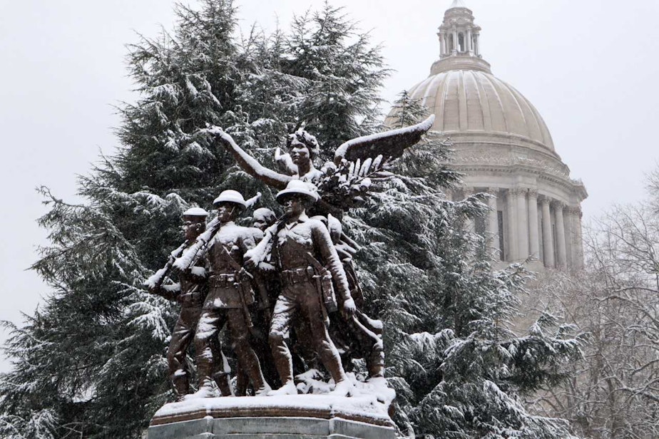 caption: Snow shades a statue in Olympia, Washington on Feb. 4, 2019.