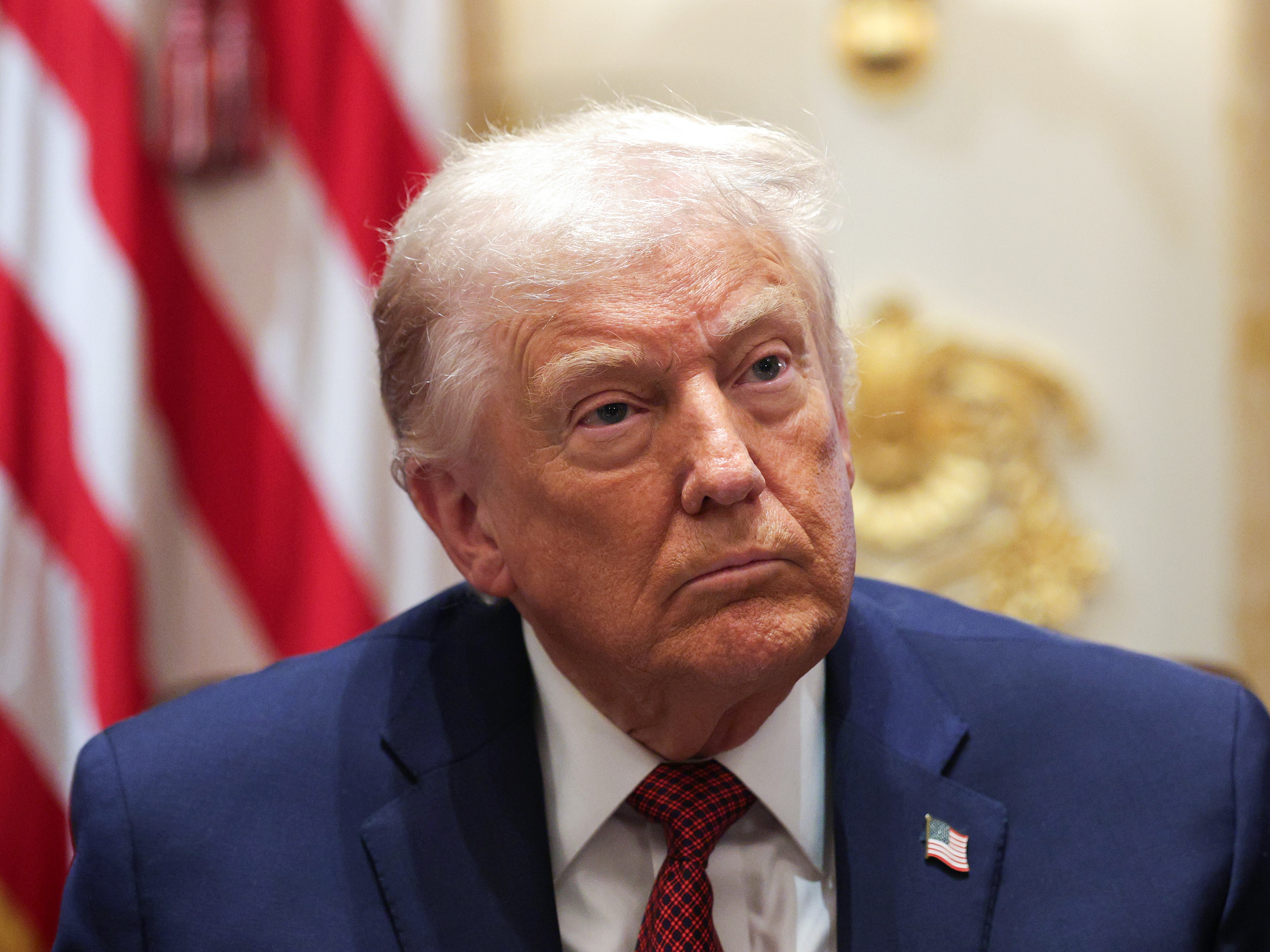 caption: U.S. President Donald Trump participates in a roundtable discussion at the White House.