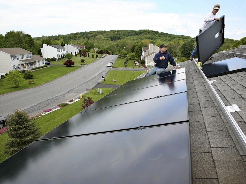 caption: The Inflation Reduction Act includes tax credits for residential solar and battery storage systems, along with other measures aimed at encouraging individuals to cut their carbon emissions.
