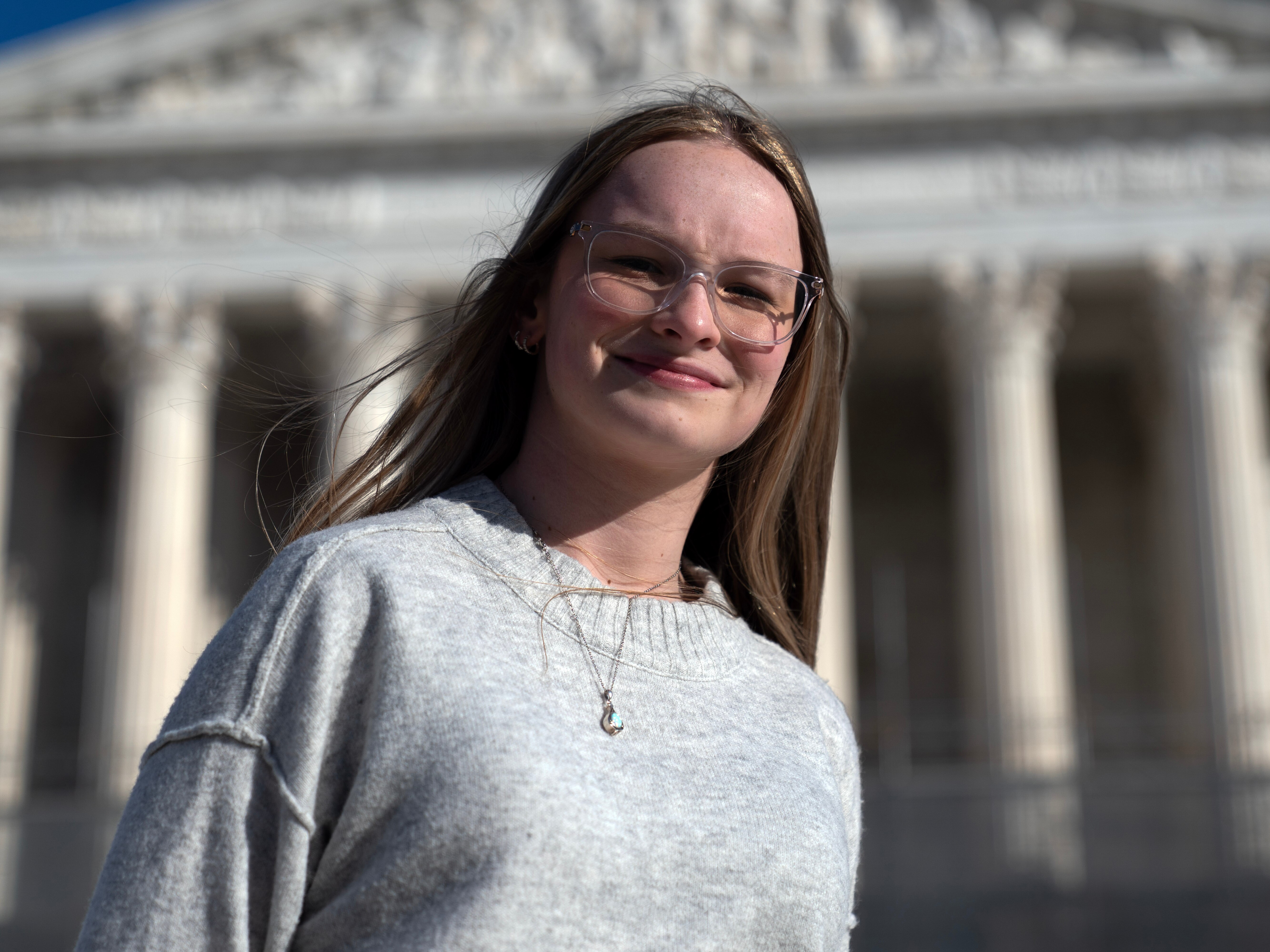 caption: Becky Pepper-Jackson, 15, poses Sunday for a photograph outside of the U.S. Supreme Court in Washington. <br><br><br><br><br><br><br><br><br><br><br><br><br>