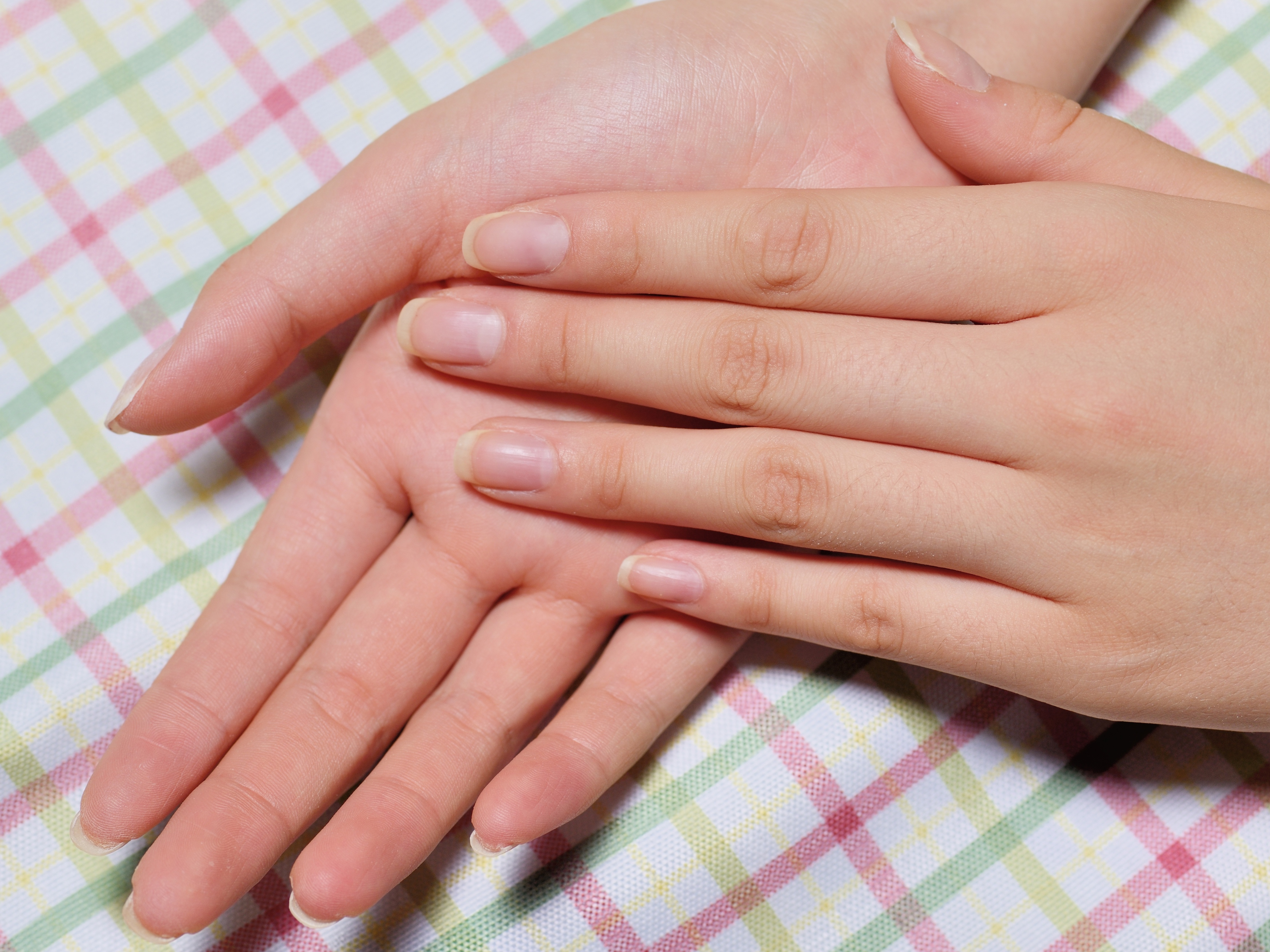 caption: "Healthy nails should be firm. They should not be soft. They should be shiny. They can have some lines in them, but they should generally be very smooth," says dermatologist <a href="https://weillcornell.org/slipner">Dr. Shari Lipner</a>.