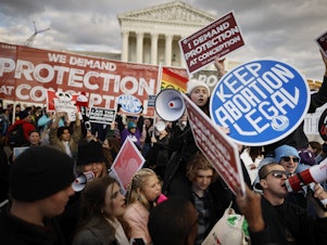 caption: Anti-abortion and abortion rights activists protest during the 50th annual March for Life rally in front of the U.S. Supreme Court on Jan. 20, 2023 in Washington, D.C.