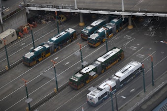 caption: Buses are shown at Convention Place Station on Tuesday, January 2, 2018, in Seattle. 
