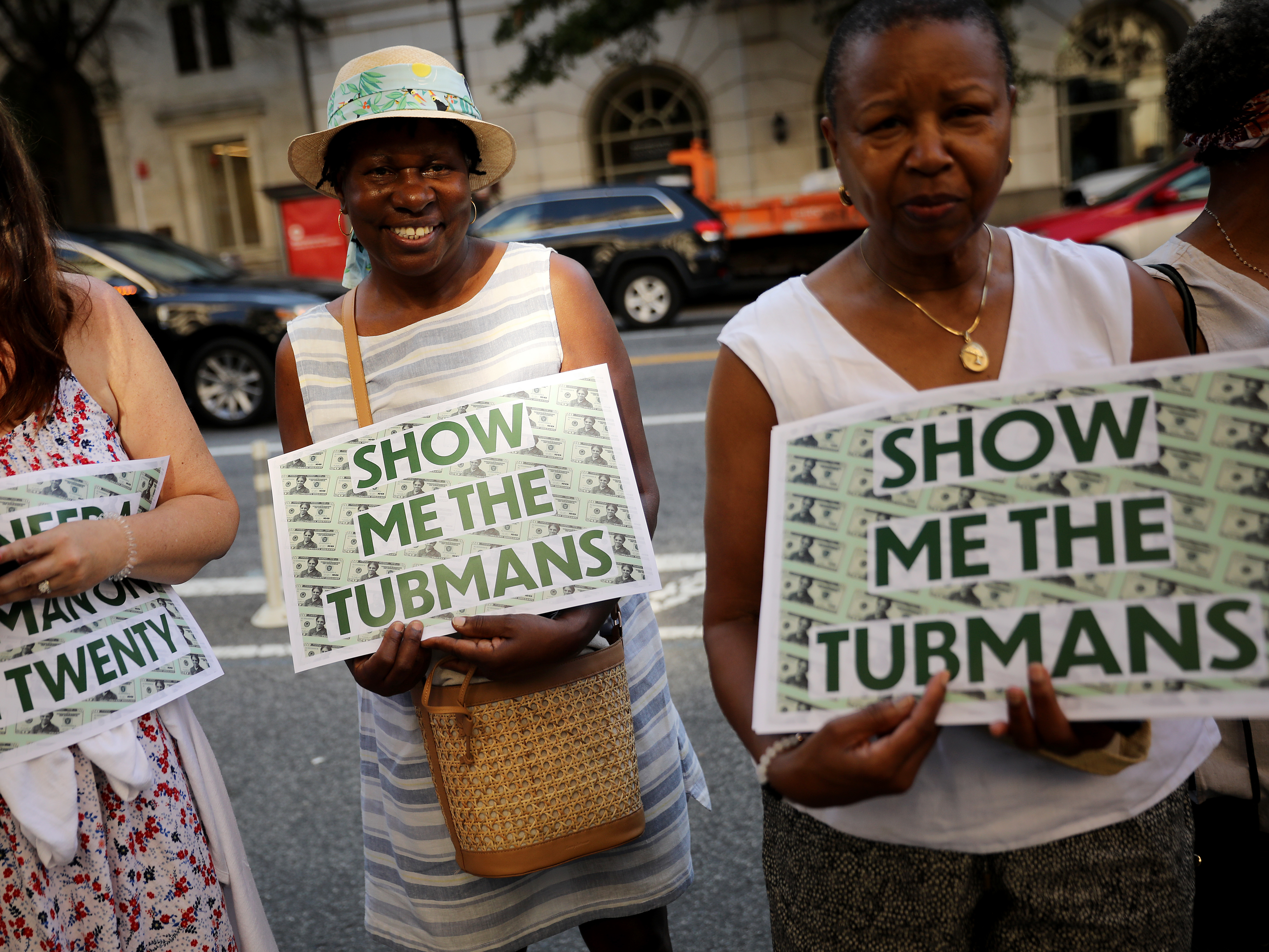 caption: Supporters rally outside the U.S. Treasury Department in 2019 to demand that American abolitionist Harriet Tubman's image be put on the $20 bill.