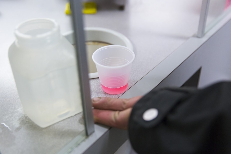 caption: The pink stuff is Kevin Boggs' daily dose of methadone, treatment for his heroin addiction. Boggs says it tastes nasty, but it has allowed him to pursue a more normal life and to get a job as a welder in Redmond. 