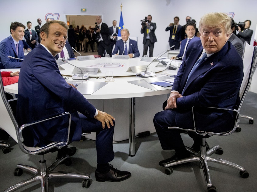 caption: French President Emmanuel Macron (left) and President Trump participate in a G-7 working session. Trump is in Biarritz, France, for the G-7 summit of the world's biggest economic powers.