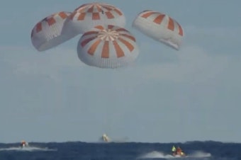 caption: The Crew Dragon landed safely in the Atlantic Ocean on Friday morning, with a splashdown at 8:45 a.m. ET, as scheduled. The uncrewed craft had been on a test flight in which it docked with the International Space Station.