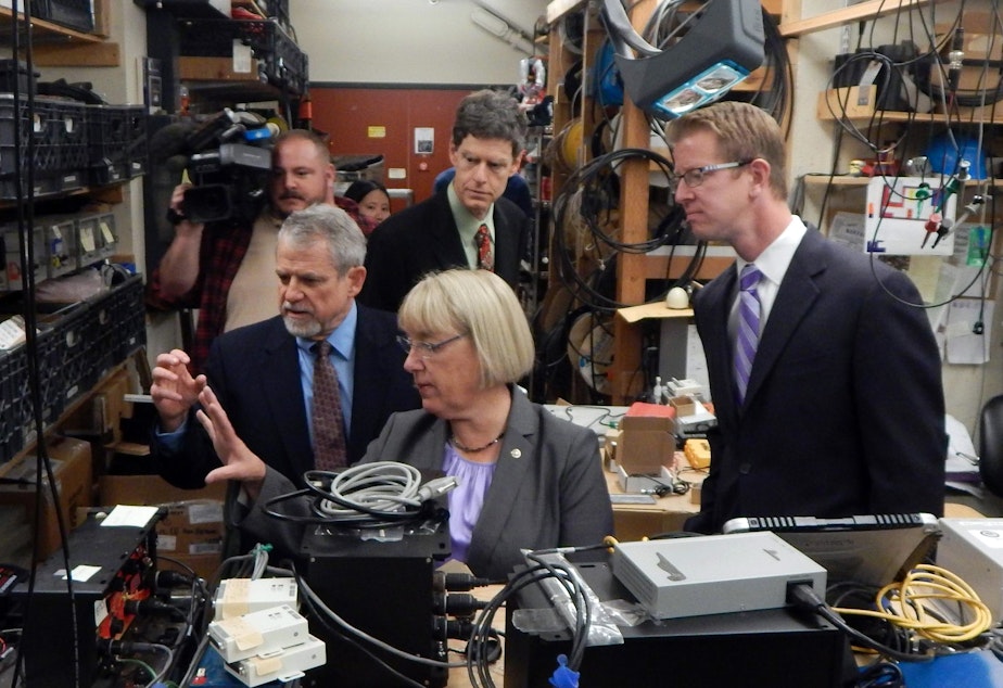 U.S. Sen. Patty Murray, center, and U.S. Rep. Derek Kilmer, right, get a tour of the Pacific Northwest Seismic Network from Paul Bodin, left, and John Vidale, rear.
