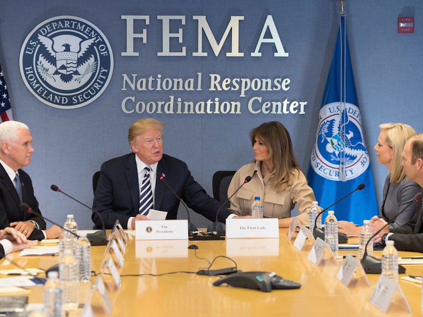 caption: President Trump, Vice President Pence and first lady Melania Trump visit the Federal Emergency Management Agency headquarters in Washington, D.C., on June 6. Secretary of Homeland Security Kirstjen Nielsen and FEMA Administrator Brock Long are seated at right. This summer, DHS transferred nearly $10 million from FEMA to immigration authorities, according to a congressional document.