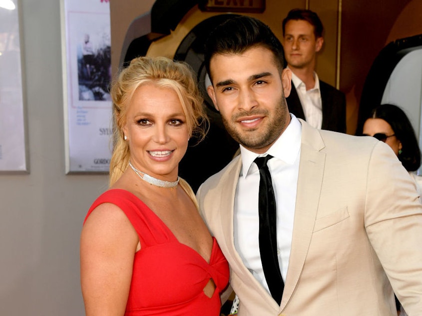 caption: Britney Spears poses with her boyfriend, Sam Asghari, at event in Hollywood in 2019.