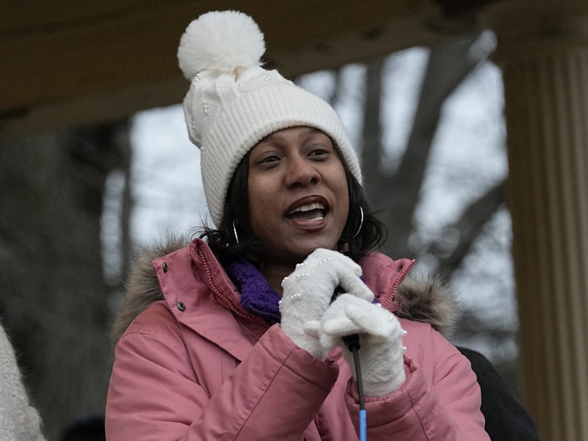 caption: Brittany Watts, center, speaks to a rally of supporters, Thursday, Jan. 11, 2024, in Warren, Ohio. A grand jury decided that Watts, who was facing criminal charges for her handling of a home miscarriage, will not be charged. Congressional Democrats are using Watts' case to call for Biden to do more on abortion rights and protection for pregnant patients.