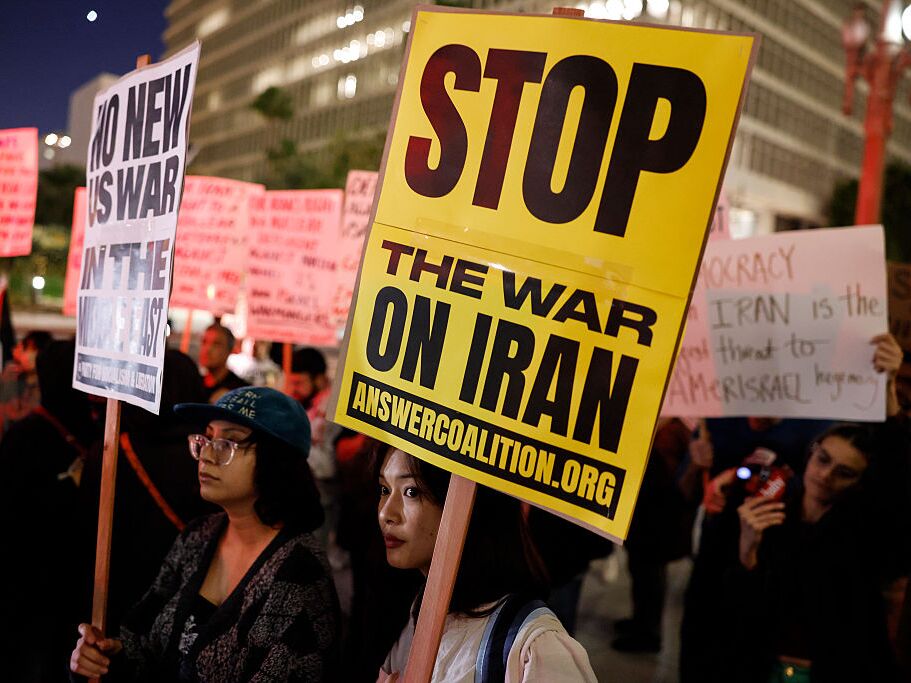 caption: Demonstrators outside City Hall in Los Angeles on March 2 protest against the U.S. and Israel's attack on Iran.