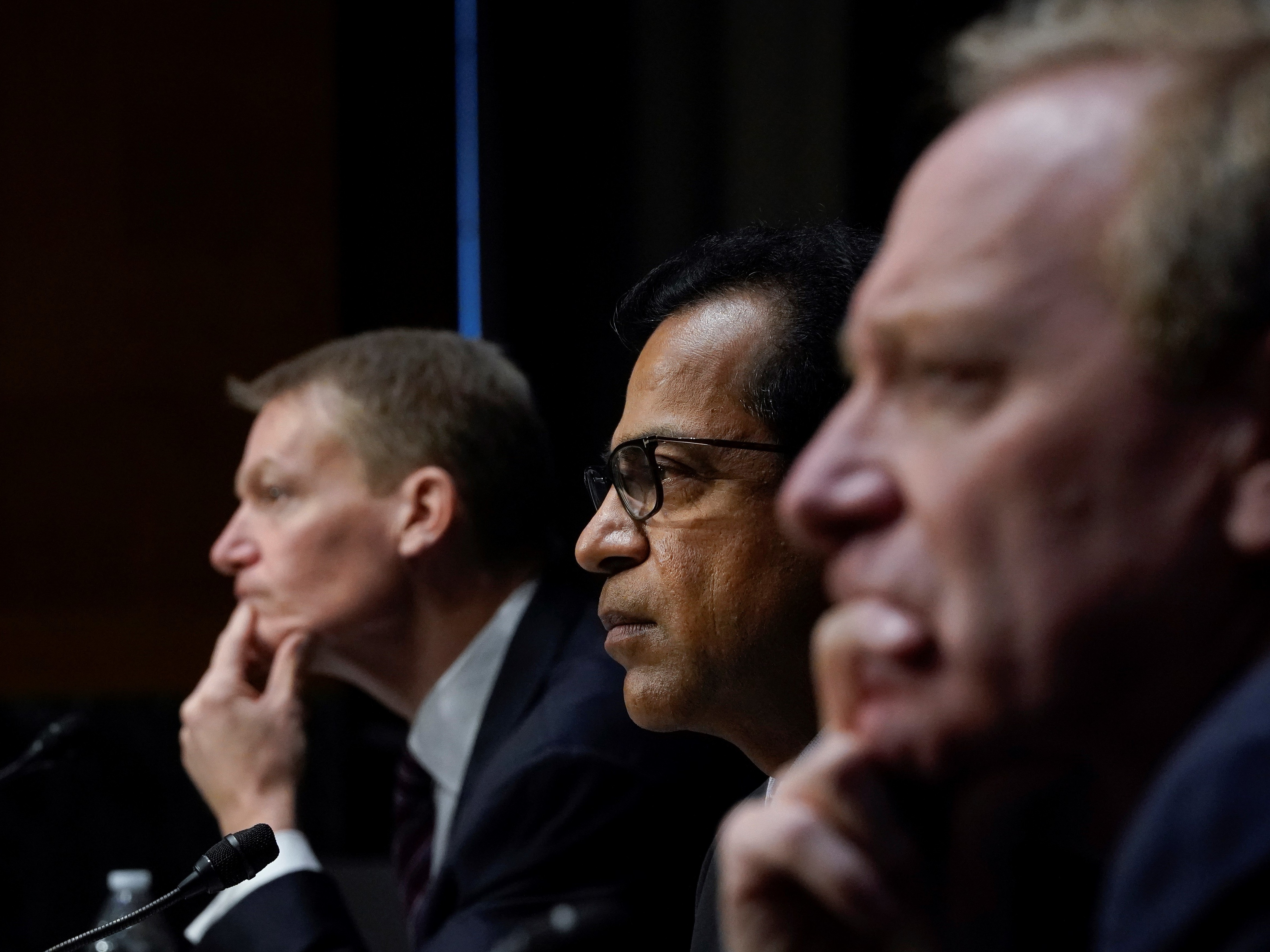 caption: FireEye CEO Kevin Mandia, SolarWinds CEO Sudhakar Ramakrishna and Microsoft President Brad Smith testify during a Senate Intelligence Committee hearing on Capitol Hill on Feb. 23, in Washington, D.C. The hearing focused on the 2020 cyberattack that resulted in a series of data breaches within several agencies and departments in the U.S. federal government.