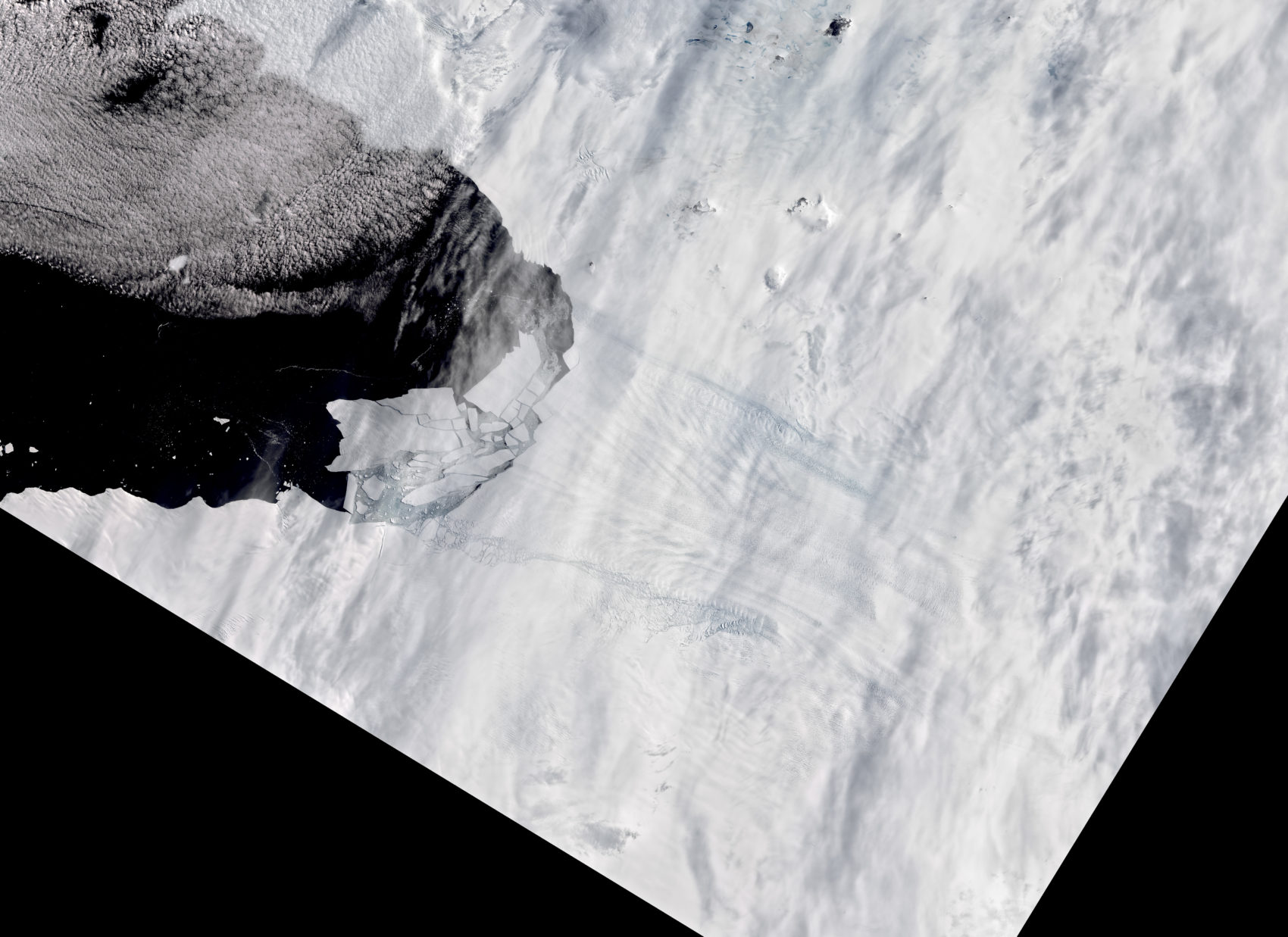 caption: Pine Island Glacier in Antarctica spawns new iceberg on February 11, 2020. (Courtesy of NASA)