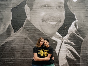 caption: Alexandra Forseth (left) and Gabriela Zambrano Hill stand in front of a mural of their father, Alirio Jose<strong> </strong>Zambrano, at an event hosted by the Bring Our Families Home Campaign in Washington, D.C., on July 20. The State Department says both their father and an uncle, Jose Luis Zambrano, are wrongfully detained in Venezuela.