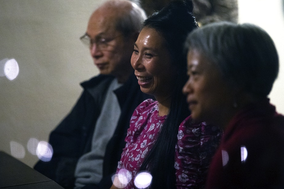 caption: From left, Truong Nguyen, Phung Nguyen and Ha Nguyen attend a dinner party conversation on Thursday, October 6, 2022, in South Park.  