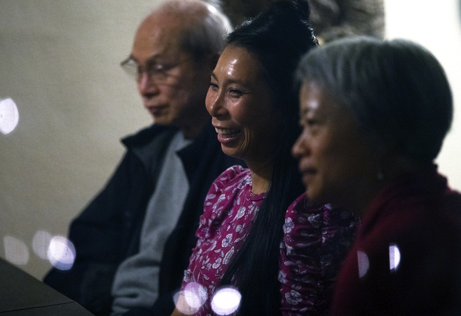 caption: From left, Truong Nguyen, Phung Nguyen and Ha Nguyen attend a dinner party conversation on Thursday, October 6, 2022, in South Park.  