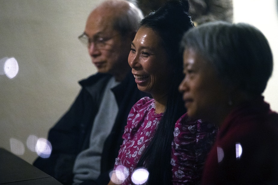 caption: From left, Truong Nguyen, Phung Nguyen and Ha Nguyen attend a dinner party conversation on Thursday, October 6, 2022, in South Park.