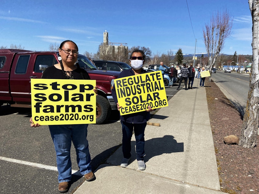 caption: Yakama Nation members Elaine Harvey (left) and her cousin Tina Antone say new solar developments in Klickitat County will displace land where they can find three different types of roots.